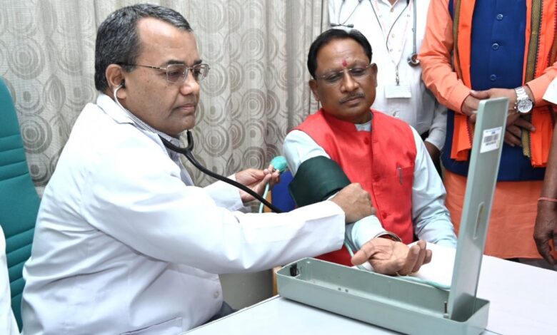 Chief Minister gives message of health awareness by checking his BP sugar at health camp.