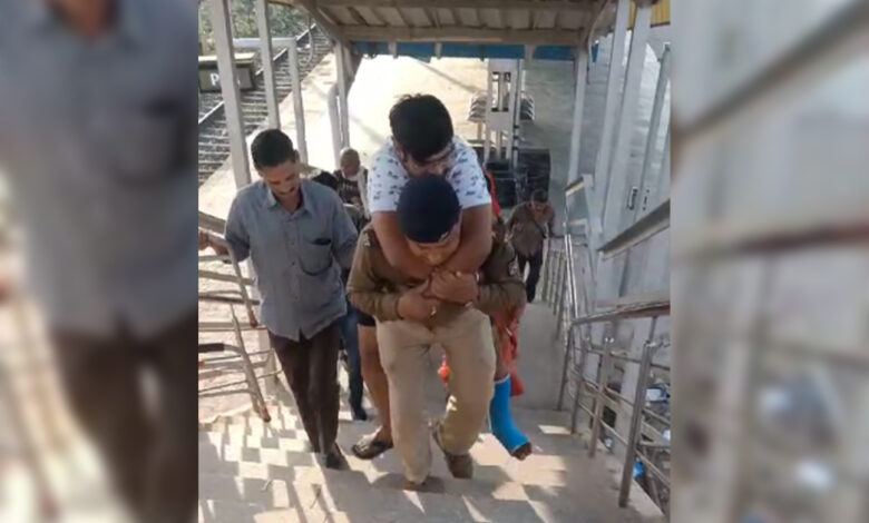 RPF jawan climbs ladder carrying passenger on shoulder, video goes viral on social media.